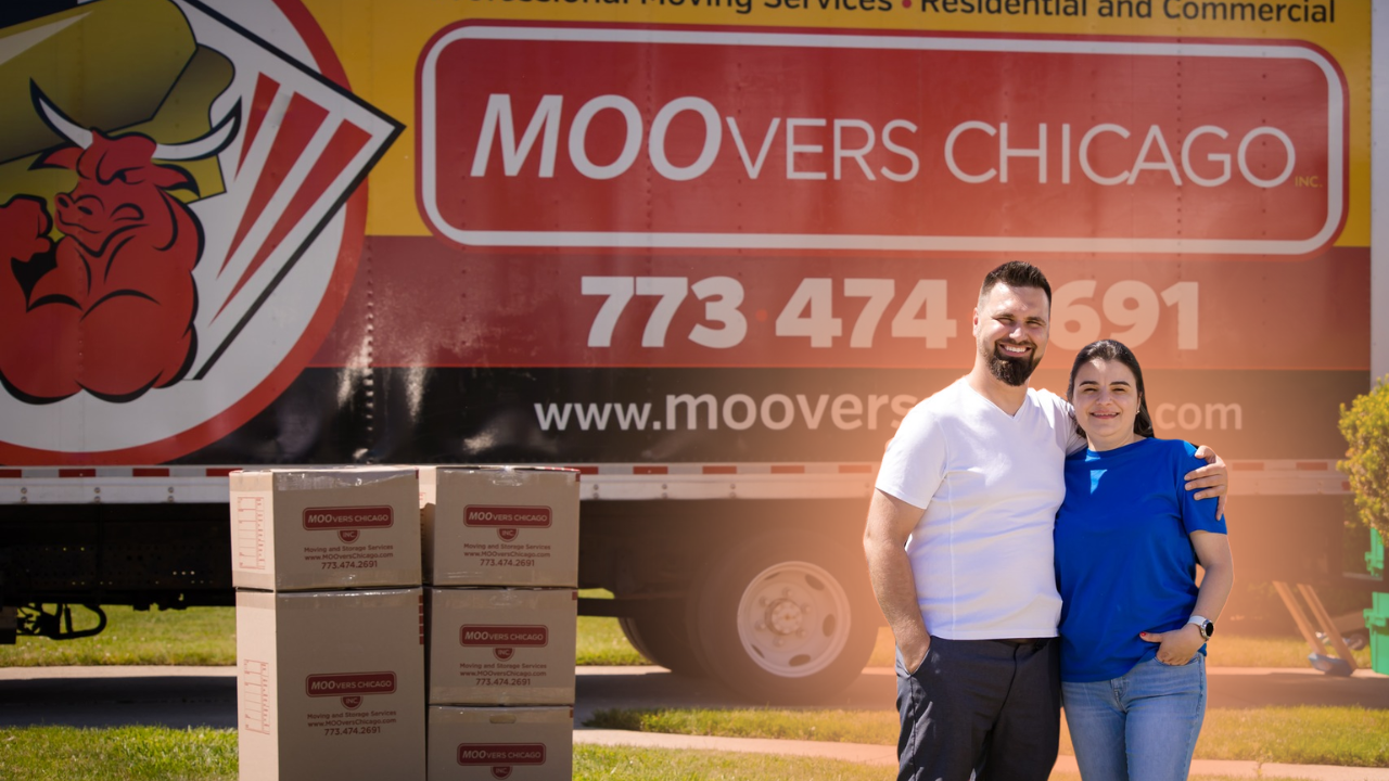 MOOvers Chicago owners in front of their moving truck